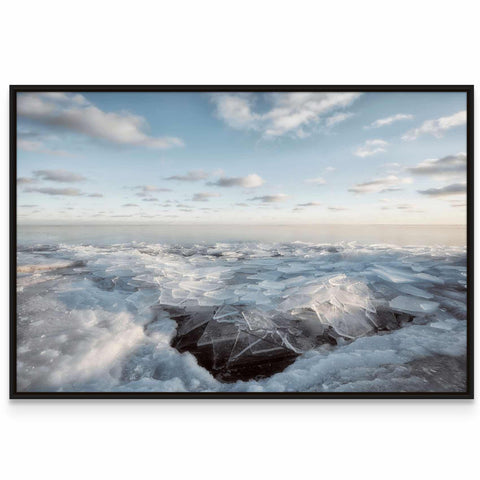 a black and white photo of a mountain covered in ice