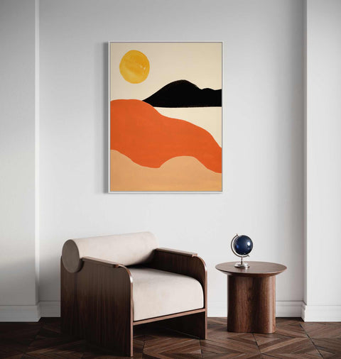 a living room with a chair and a painting on the wall