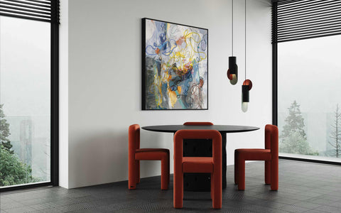 a table and chairs in a room with large windows