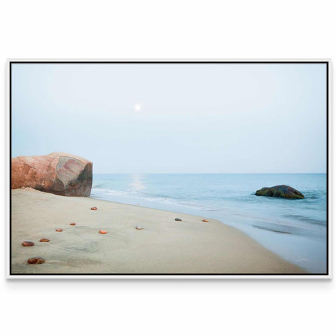 a picture of a beach with rocks and water