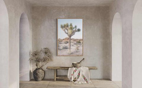 a room with a bench and a painting on the wall